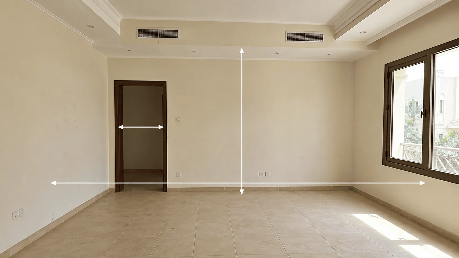 Empty room measured during a site assessment for interior design studio services